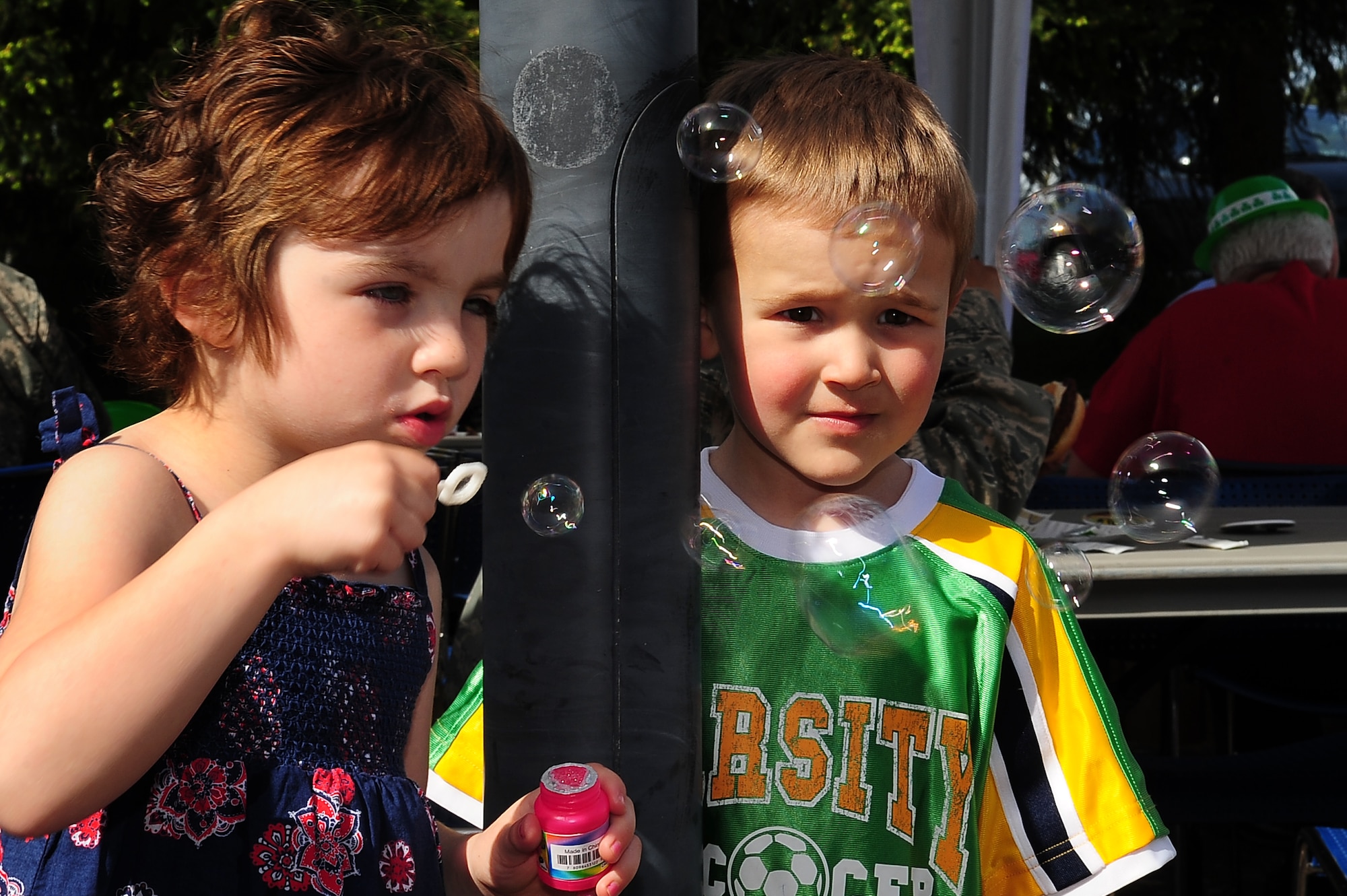 Jamie Mason and Jackson Benwitz, children of U.S. Air Force Master Sgt. Billy Mason, 17th Air Force and Maj. Kyle Benwitz, 617th Air and Space Operations Center, play with bubbles during a community event hosted by the 86th Services Squadron outside of the Northside Post Office, Ramstein Air Base, Germany, April 29, 2010. More than 150 members of the squadron volunteered their day setting up food booths, face-painting stands and a bouncy castle at the event to simply show gratitude to the community. (U.S. Air Force photo by Senior Airman Tony R. Ritter)