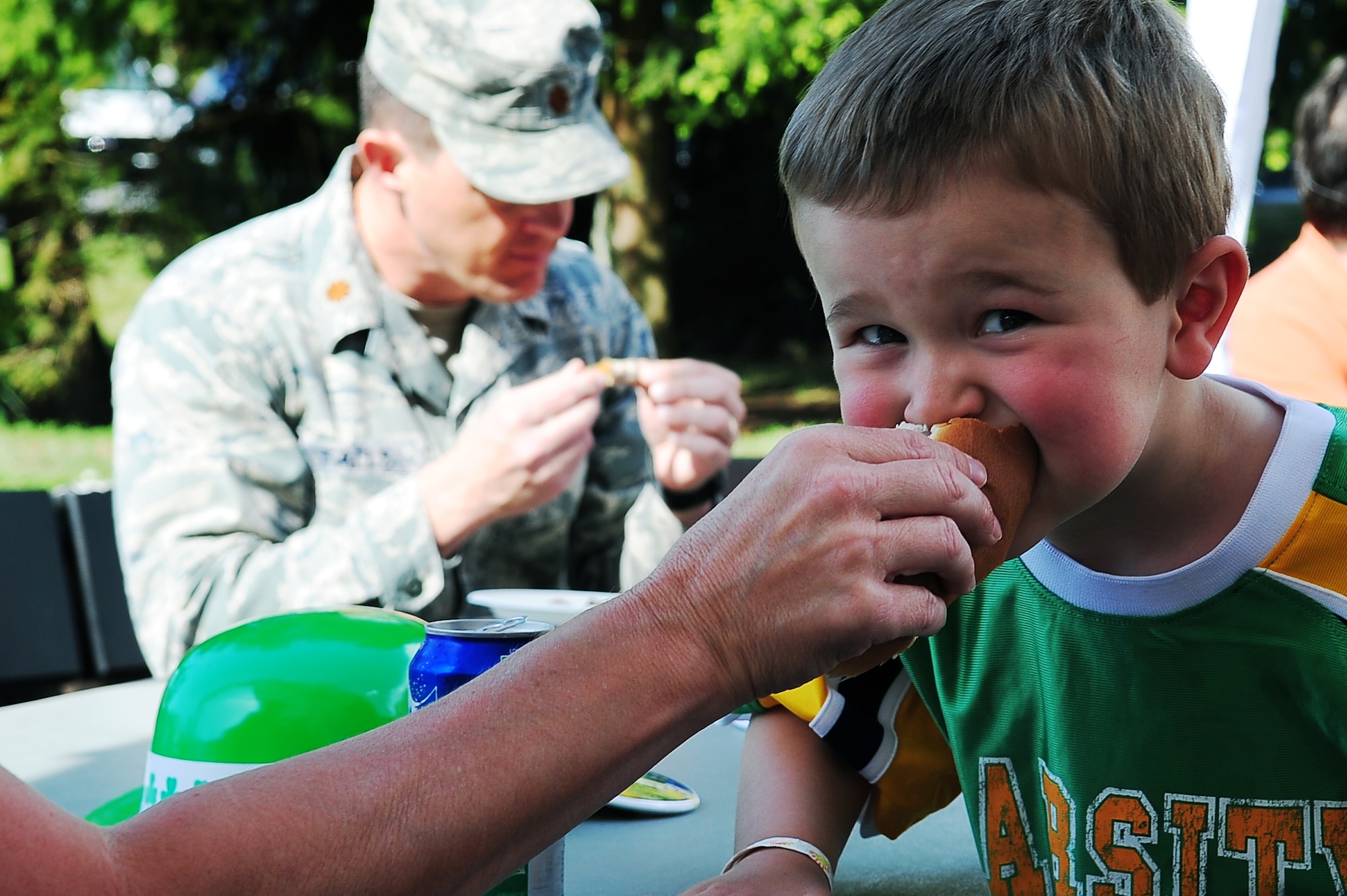 Jackson Benwitz, son of U.S. Air Force Maj. Kyle Benwitz, 617th Air and Space Operations Center, enjoys a hotdog during a community event hosted by the 86th Services Squadron outside of the Northside Post Office, Ramstein Air Base, Germany, April 29, 2010. More than 150 members of the squadron volunteered their day setting up food booths, face-painting stands and a bouncy castle at the event to simply show gratitude to the community. (U.S. Air Force photo by Senior Airman Tony R. Ritter)