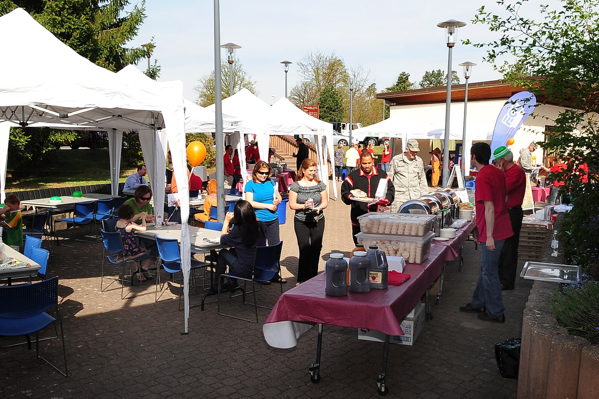 A community event is hosted by the 86th Services Squadron outside of the Northside Post Office, Ramstein Air Base, Germany, April 29, 2010. More than 150 members of the squadron volunteered their day setting up food booths, face-painting stands and a bouncy castle at the event to simply show gratitude to the community. (U.S. Air Force photo by Senior Airman Tony R. Ritter)