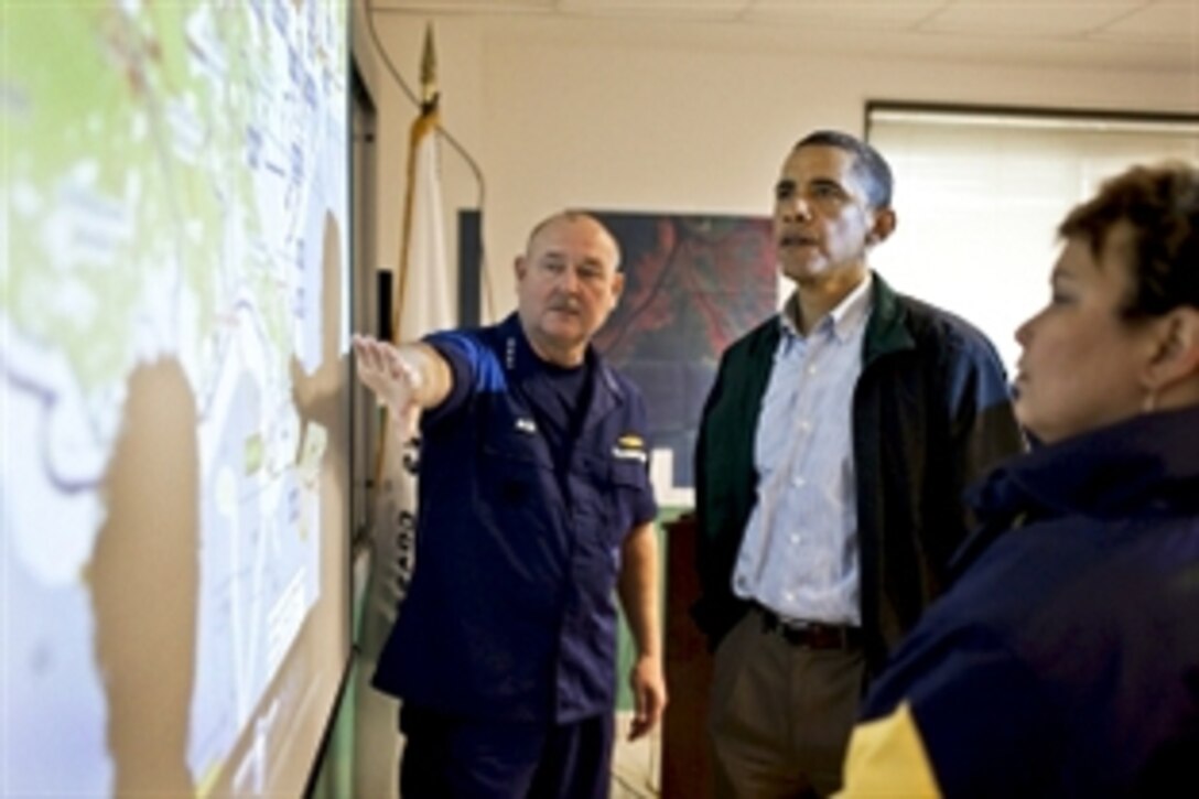 U.S. Coast Guard Commandant Adm. Thad Allen, serving as the national incident commander, discusses the Gulf Coast region with President Barack Obama in Venice, La., May 2, 2010, as he reviews recovery efforts following the BP oil well spill. 