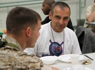 Marines with Company K, 3rd Battalion, 24th Marine Regiment share their experiences with clients at the New England Homeless Veterans Center, while participating in a community outreach project May 3, 2010. Marine Week Boston, which runs from May 3-9, is an opportunity for local citizens to meet the men and women of the Marine Corps and learn about its history, traditions and significance to the U.S.