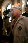 A retired Marine veteran salutes during the national anthem during Marine Week Bostonâ??s proclamation ceremony in Faneuil Hall, May 3, 2010. The ceremony marked May 3 the official commencement of Marine Week Boston, May 3-9, 2010.