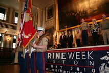 Color guardsmen with 25th Marine Regiment, Fort Devens, Mass.,-based, and Boston Mayor Thomas Menino, U.S. Representative Stephen Lynch of Ninth District Mass., Lt. Gen. Joseph Dunford, commanding general of 1st Marine Expeditionary Force, and guests stand during the playing of the national anthem during Marine Week Boston's proclamation ceremony in Faneuil Hall, May 3, 2010. The ceremony marked May 3 the official commencement of Marine Week Boston, May 3-9, 2010. Marine Week is an opportunity to share the Corps' culture, history and traditions with Bostonians and for them to learn about the Corps' value to the nation.