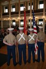 (From left) Cpl. Alexander G. Hollings, a native of Bennington, Vt., Sgt. Timothy C. Bos, a native of Sheridan, Mich., Sgt. Lawrence J. Wolfe, a native of Springfield, Mo., and Lance Cpl. Keith B. Dickey, a native of Nashua, N.H., color guardsmen with 25th Marine Regiment, Fort Devens, Mass., -based, stand before the audience  at Marine Week Boston's proclamation ceremony in Faneuil Hall, May 3, 2010. The ceremony marked May 3 the official commencement of Marine Week Boston, May 3-9, 2010.