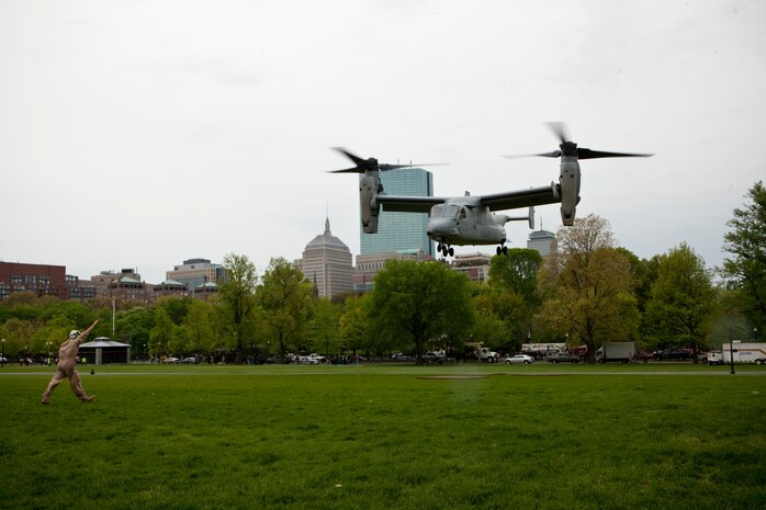 An AH-1 Cobra helicopter circles Boston Common before coming in for a landing inside the park May 3. The flyover demonstration was during the first day of Marine Week Boston, which honors and recognizes the contributions of Marines, including Boston-based hometown heroes and their families.