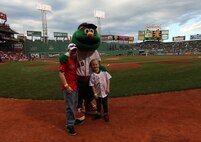 Jake and Shaelin Murphy, the son and daughter of Maj. Neil Murphy of New York City Public Affairs pose for a photo with Boston Red Sox mascot Wally at Fenway Park May 3, 2010, after they completed their job as honorary bat boy and bat girl.
