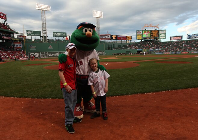 Jake and Shaelin Murphy, the son and daughter of Maj. Neil Murphy of New York City Public Affairs pose for a photo with Boston Red Sox mascot Wally at Fenway Park May 3, 2010, after they completed their job as honorary bat boy and bat girl.