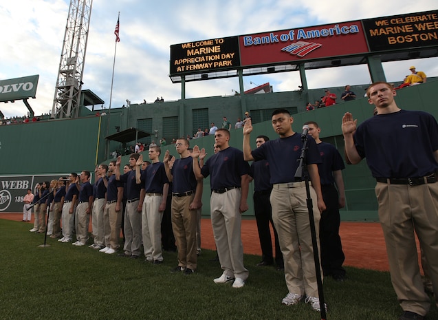 Twenty men and women from the Boston area swear in to an oath of enlistment into the Marine Corps in front of thousands at Fenway Park May 3, 2010, during the parks Marine Appreciation Day festivities.