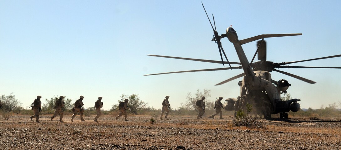 Marines of 1st Battalion, 1st Marine Regiment, load onto CH-53 Super Stallion following a helicopter-borne raid on a simulated insurgent camp in the Chocolate Mountains in California, May 3, 2010. Inserting in four different locations, via MV-22 Ospreys, CH-46 Sea Knights and CH-53 Super Stallions, Companies B and C, along with the Weapons Company, assaulted the camp with small-arms fire and rockets. Here supporting the current Weapons and Tactics Instructor course, the Camp Pendleton, Calif.-based unit is also training for a deployment early next year with the 13th Marine Expeditionary Unit.