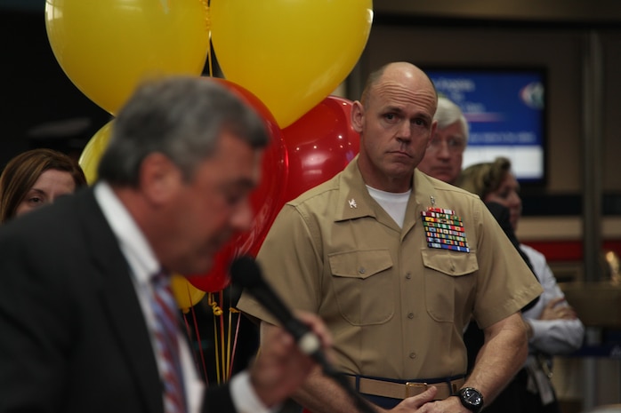 Col. Robert T. Durkin, commanding officer of the 25th Marine Regiment, listens intently during the gate dedication ceremony, May 3, 2010 at Logan Internation Airport.  Gate 33B was dedicated to the Marine Corps during Marine Week Boston to show the airline's appreciation to the Marine Corps.