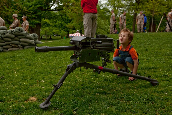 Nicholas Martin, a 4-year-old from Medford, Mass., sights in on an MK-19 grenade launcher during an exhibition of crew-served weapons used by Marines at Boston Common May 3. The exhibition was during the first day of Marine Week Boston, which honors and recognizes the contributions of Marines, including Boston-based hometown heroes and their families.