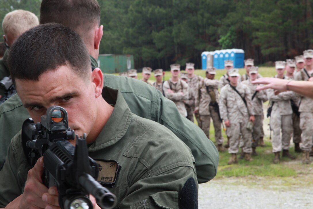Lance Cpl. Jeremy R. George, a military policeman with Camp Lejeune’s special reaction team, participates in a demonstration for Military Police Company, 2nd Marine Aircraft Wing, during a field training exercise, May 4. Camp Lejeune’s SRT taught the Marines of MP Co. basic structure-clearing techniques.