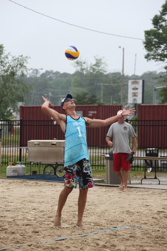Chad Christensen, member of the first Marine Corps men’s beach volleyball team, serves during the beach volleyball tournament, May 4. Christensen was selected for the Men’s Armed Forces team that will play in Phoenix later this month.