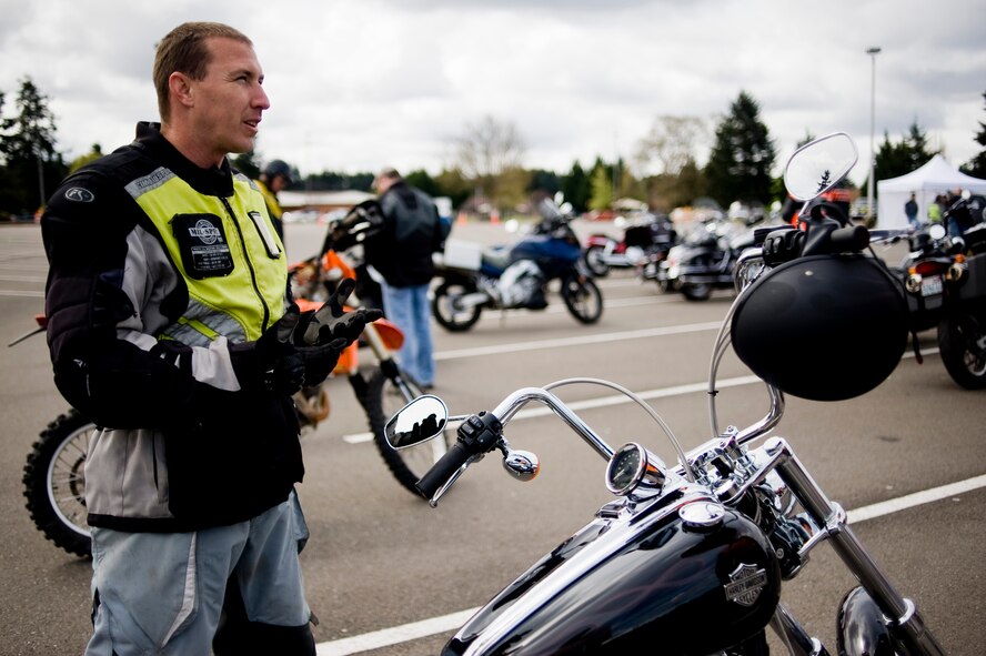 Staff Sgt. Aaron Massey, 62nd Force Support Squadron, offers safety tips for riders participating in a motorcycle awareness event on McChord Field May 4. The event, designed to promote May as "National Motorcycle Awareness Month," featured safety tips from experienced riders, bike challenges, lunch for participants and vendors from the local area. (U.S. Air Force Photo/Abner Guzman)
