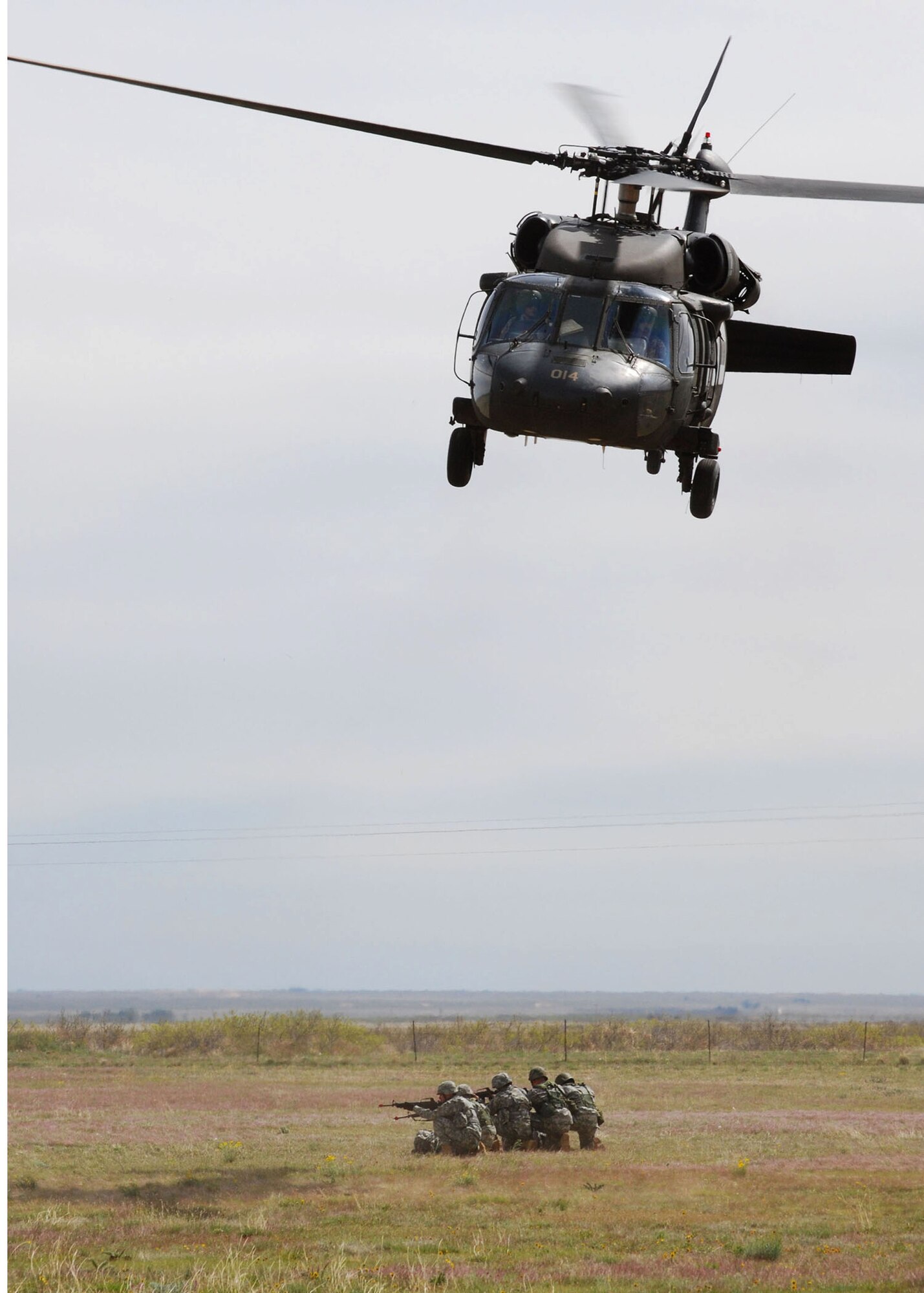 A UH-60 Black Hawk helicopter takes off over Melrose Air Force Rage after transporting four members of the New Mexico Army National Guard. The team demonstrated an air assault and simulated pilot rescue for guests of the Employer Support of the Guard and Reserve "Boss Lift" May 1.  (U.S. Air Force photo by 2nd Lt. Stephanie Strine)