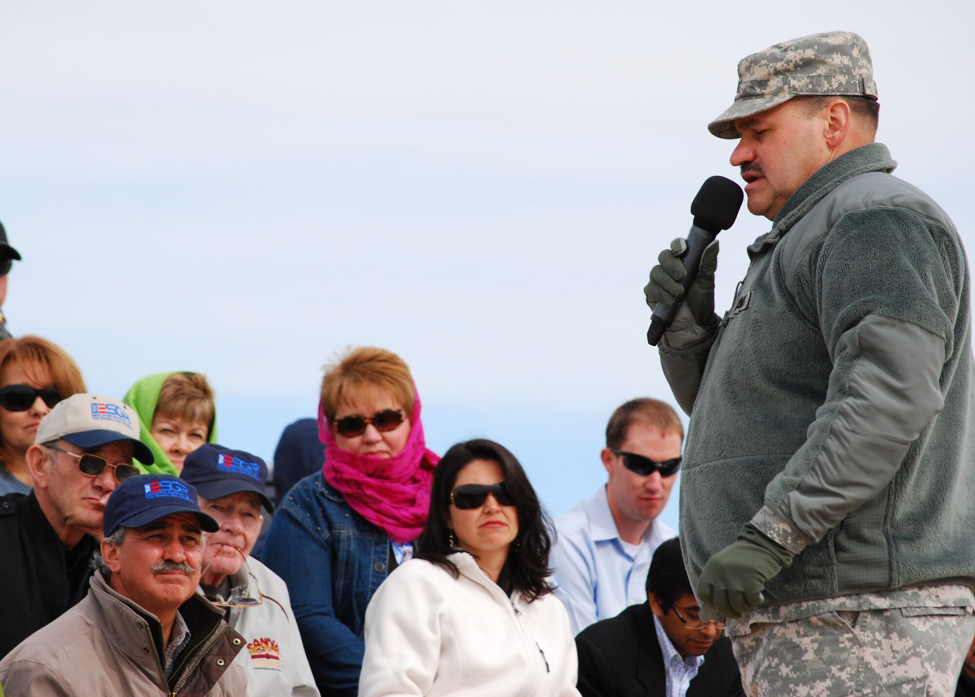 Col. Richard Clark, Deputy Chief of Staff for Training Operations for the New Mexico National Guard, narrates an F-16 Fighting Falcon demonstration to more than 50 people attending the Employer Support of the Guard and Reserve "Boss Lift." New Mexico employers gathered at Melrose Air Force Range May 1 for the annual  event that shows employers how their Guards and Reserve forces  train while on active duty. The event followed an awards and recognition banquet held April 30 at the Clovis Civic Center.  The F-16 demonstration included bombing targets on the range, simulated strafing, a show of force and communication with concealed Marine Reserve Joint Terminal Attack Controllers on the ground. (U.S. Air Force photo by 2nd Lt. Stephanie Strine)