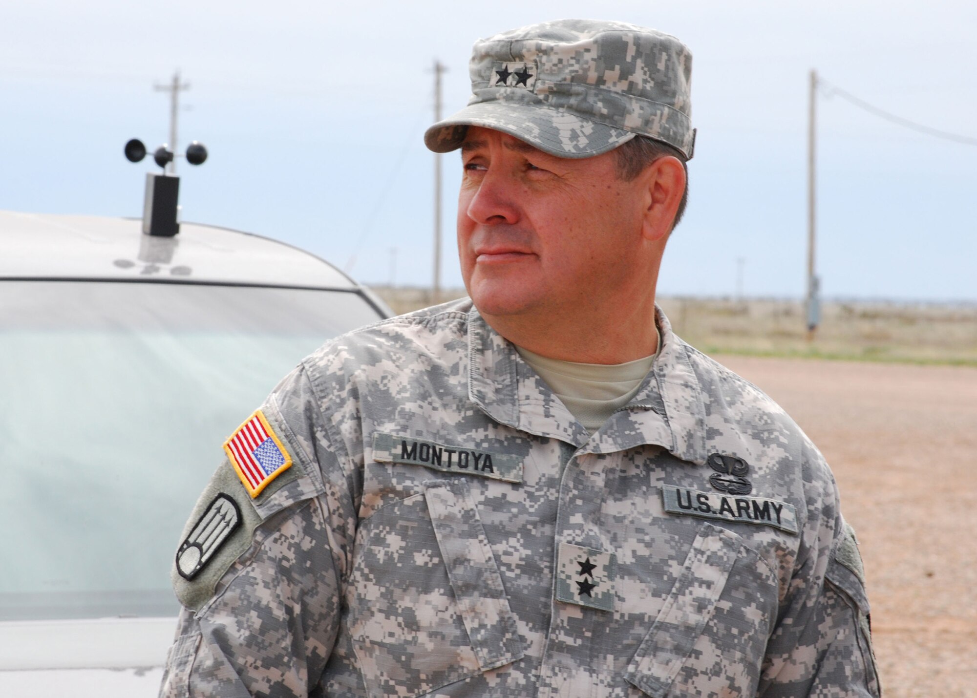 Maj. Gen. Kenny C. Montoya, Adjutant General of the New Mexico National Guard, observes a UH-60 Black Hawk helicopter air assault demonstration at Melrose Air Force Range May 1 during the annual Employer Support of the Guard and Reserve "Boss Lift" May 1. The event shows area employers some of the training their employees undergo while on active duty. (U.S. Air Force photo by 2nd Lt. Stephanie Strine)