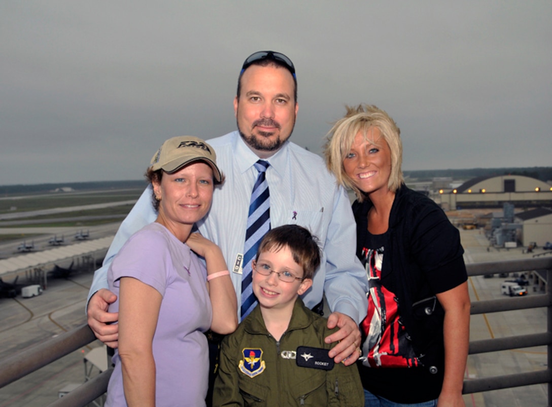 The Shuman Family (from left – Tanya, Chris, Ashley Kelly and Jordan) poses from high above Tyndall AFB’s flightline as they toured the 325th Operations Support Squadron control tower during Jordan visit to the base as a “Pilot for the Day” April 20, 2010.
