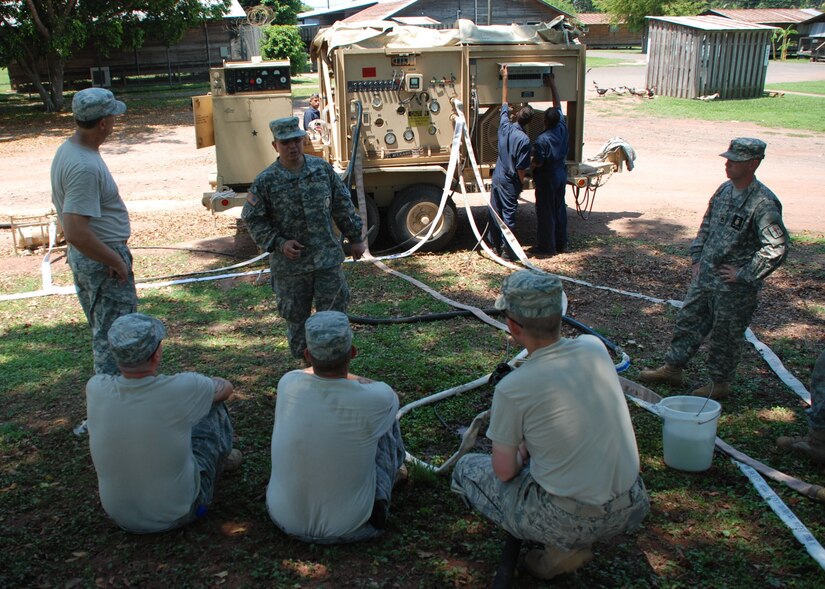 Sergeant 1st Class Armando Arteagaharo, water training instructor from Ft. Lee, Va., conducts a class on operating the Reverse Osmosis Water Purification Unit at Soto Cano Air Base, Honduras, May 4. The ROWPU training course, taking place May 3-7, teaches JTF-Bravo members how to operate the system, which can be used to provide drinkable water from any water source. JTF-Bravo maintains ROWPU capability in order to assist in disaster relief situations where clean drinking water is needed. (U.S. Air Force photo by 1st Lt. Jen Richard)