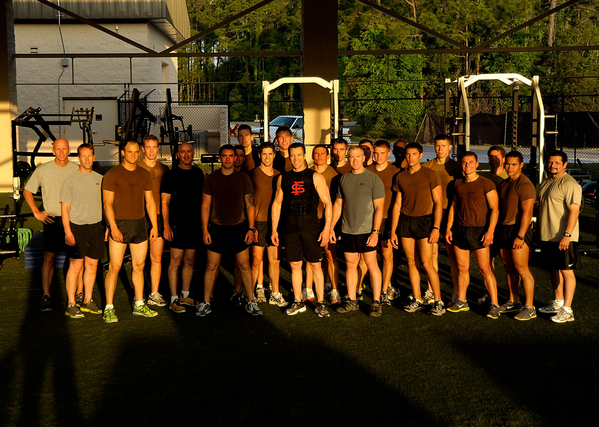 Tony Horton, creator of the P90X, and participant of the Joint Civilian Orientation Course (JCOC) poses with the Special Tactics Training Squadron students after he ran them through a workout on April 29, 2010 at Hurlburt Field, Fla. JCOC is a Secretary of Defense sponsored program, which gives civilian community leaders the opportunity to learn about the military and national defense. (U.S. Air Force photo by Master Sgt. Russell E. Cooley IV)(Released)
