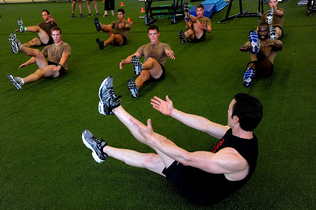 Tony Horton, creator of the P90X, and participant of the Joint Civilian Orientation Course (JCOC) runs the Special Tactics Training Squadron students through a workout on April 29, 2010 at Hurlburt Field, Fla. JCOC is a Secretary of Defense sponsored program, which gives civilian community leaders the opportunity to learn about the military and national defense. (U.S. Air Force photo by Master Sgt. Russell E. Cooley IV)(Released)