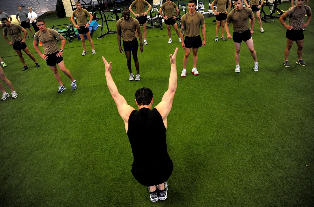 Tony Horton, creator of the P90X, and participant of the Joint Civilian Orientation Course (JCOC) runs the Special Tactics Training Squadron students through a workout on April 29, 2010 at Hurlburt Field, Fla. JCOC is a Secretary of Defense sponsored program, which gives civilian community leaders the opportunity to learn about the military and national defense. (U.S. Air Force photo by Master Sgt. Russell E. Cooley IV)(Released)