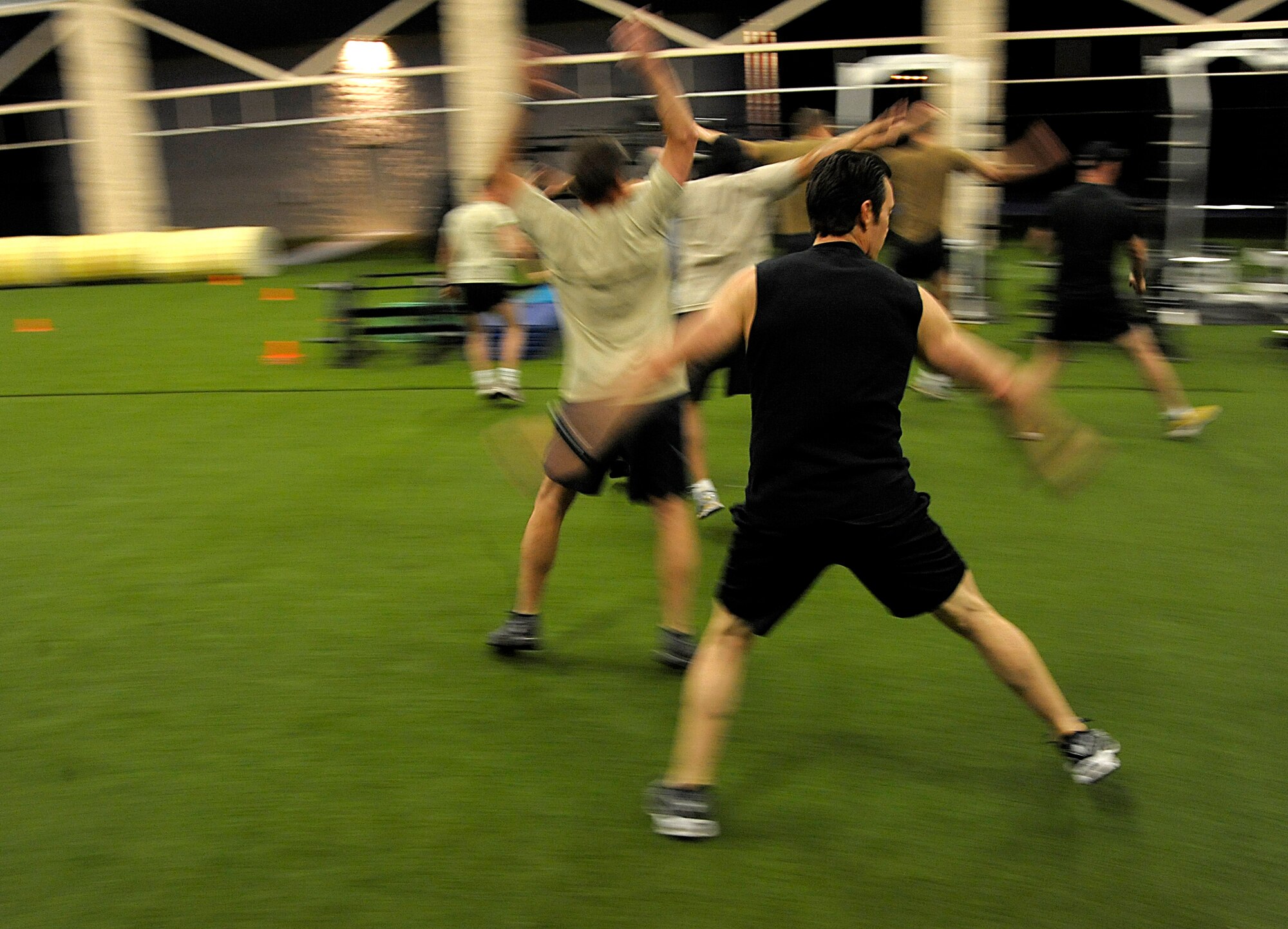 Tony Horton, creator of the P90X, and participant of the Joint Civilian Orientation Course (JCOC) runs the Special Tactics Training Squadron students through a workout on April 29, 2010 at Hurlburt Field, Fla. JCOC is a Secretary of Defense sponsored program, which gives civilian community leaders the opportunity to learn about the military and national defense. (U.S. Air Force photo by Master Sgt. Russell E. Cooley IV)(Released)
