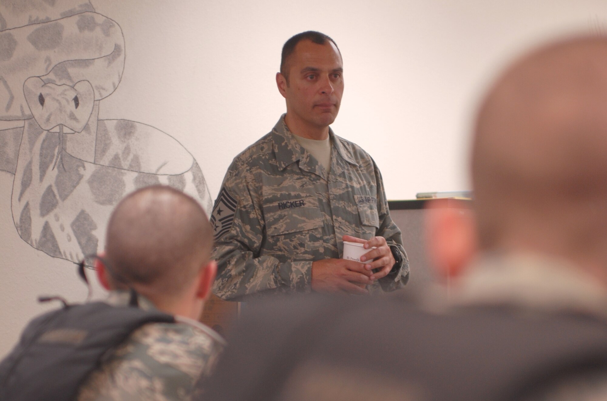 GOODFELLOW AIR FORCE BASE, Texas--17th Training Wing Command Chief Master Sgt. Frederick Ricker, talks to more than 70 brand new airmen during a briefing in Building 3206, Tuesday. The technical training class was one of Chief Ricker's last chances to influence incoming students here before moving on to his next assignment at Lackland AFB, Texas, where the students graduated from Basic Military Training just days prior to seeing Chief Ricker. (U.S. Air Force photo/ Senior Airman Tong Duong)