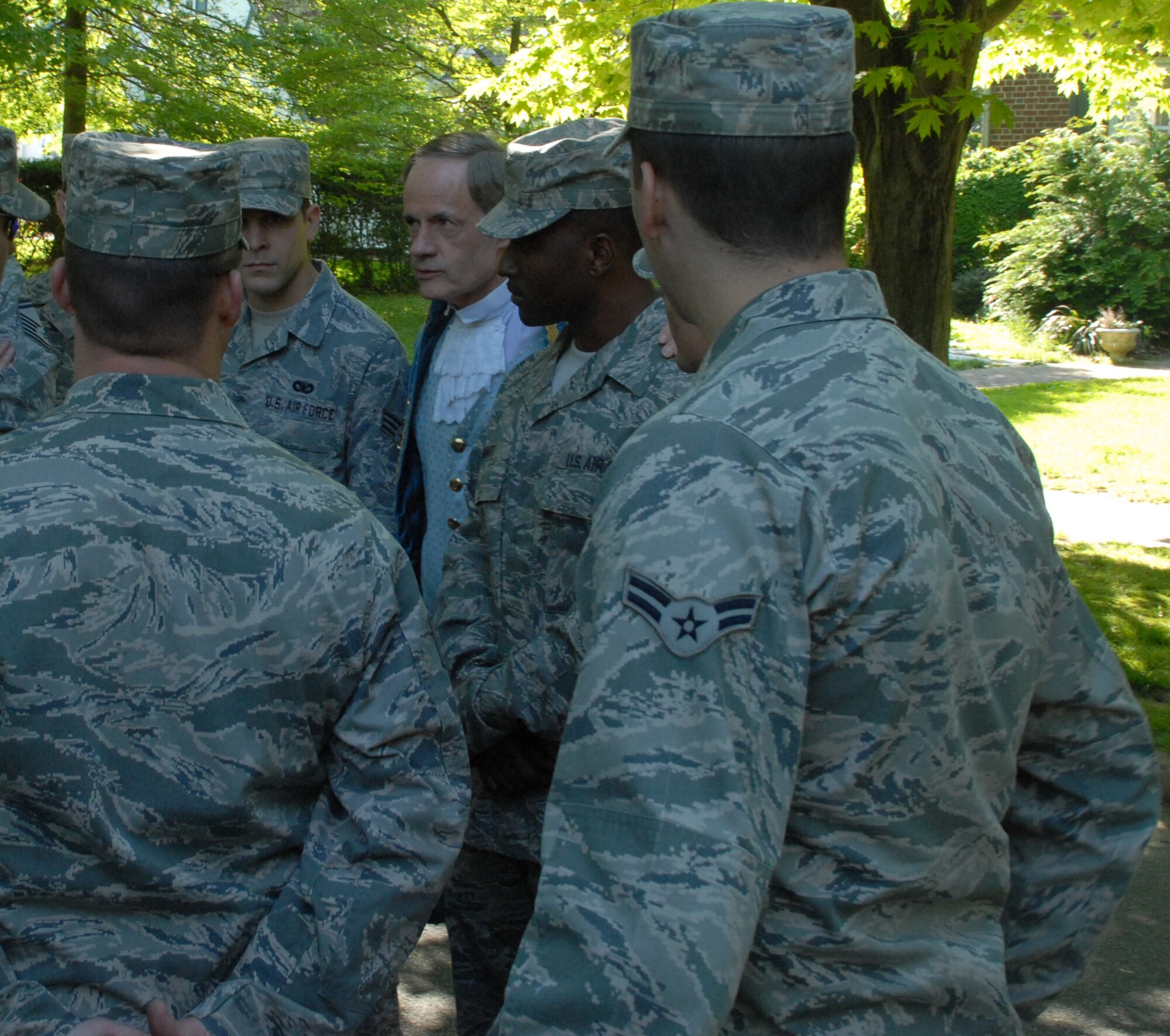 (Center) Sen. Tom Carper talks with Dover Air Force Base members before the Dover Days Parade May 1.  (U.S. Air Force photo/Staff Sgt. Chad Padgett)