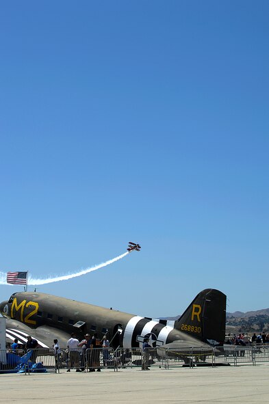 Demonstration pilot Tim Decker soars above the crowd at the March Field AirFest, March Air Reserve Base, Calif., May 2, 2010. The AirFest is a bi-annual, two-day event featuring military and civilian aerial performances and static displays of modern and historic aircraft. (U.S. Air Force photo by Tech. Sgt. Carolyn Erfe/released)