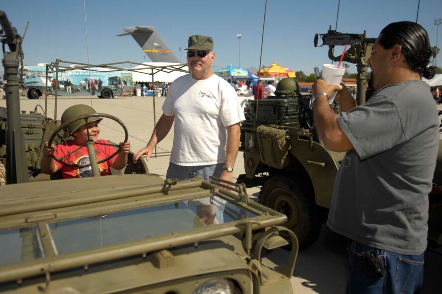 The crowd enjoys a static display at the March Field AirFest, March Air Reserve Base, Calif., May 2, 2010. The AirFest is a bi-annual, two-day event featuring military and civilian aerial performances and static displays of modern and historic aircraft. (U.S. Air Force photo by Tech. Sgt. Carolyn Erfe/released)