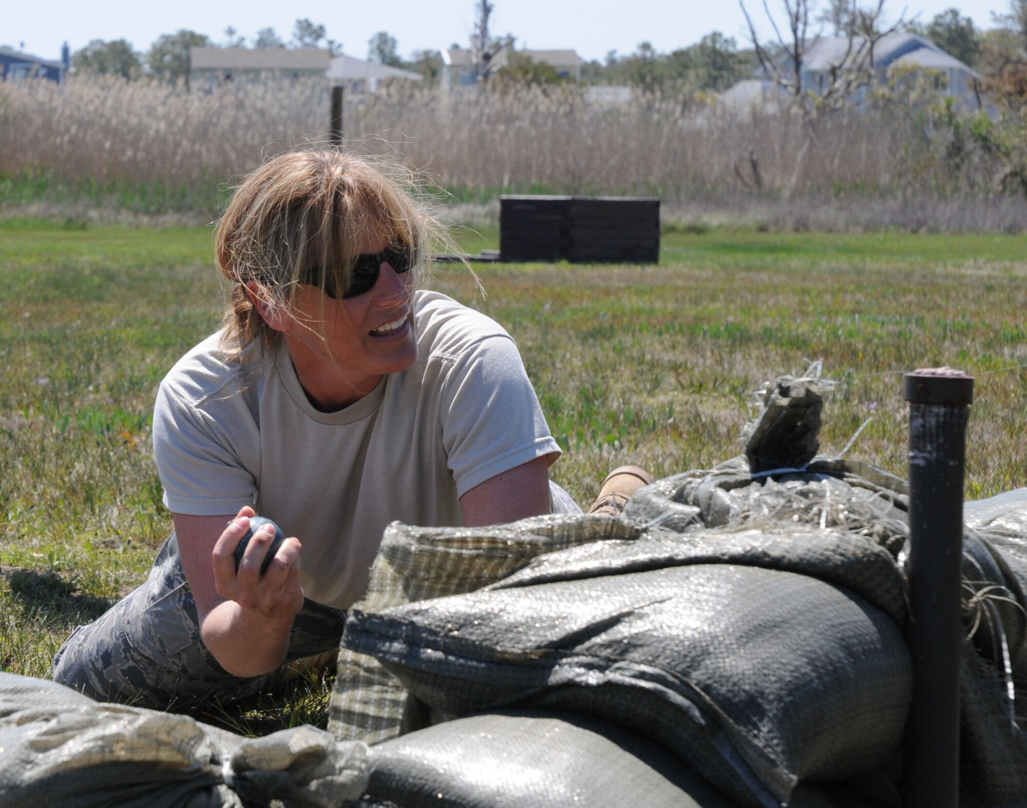 Capt. Shirley Whitney, 512th Airlift Control Flight, prepares to throw a dummy grenade at the National Guard Bethany Beach Training Site April 30.  Captain Whitney was one of more than 60 Air Force Reserve officers who attended the Junior Officer Leadership Development course April 29 to May 2.  The Air Force Reserve's 512th Airlift Wing hosted the event, which was coordinated by the unit's Company Grade Officer's Council. (U.S. Air Force photo/Capt. Marnee A.C. Losurdo)