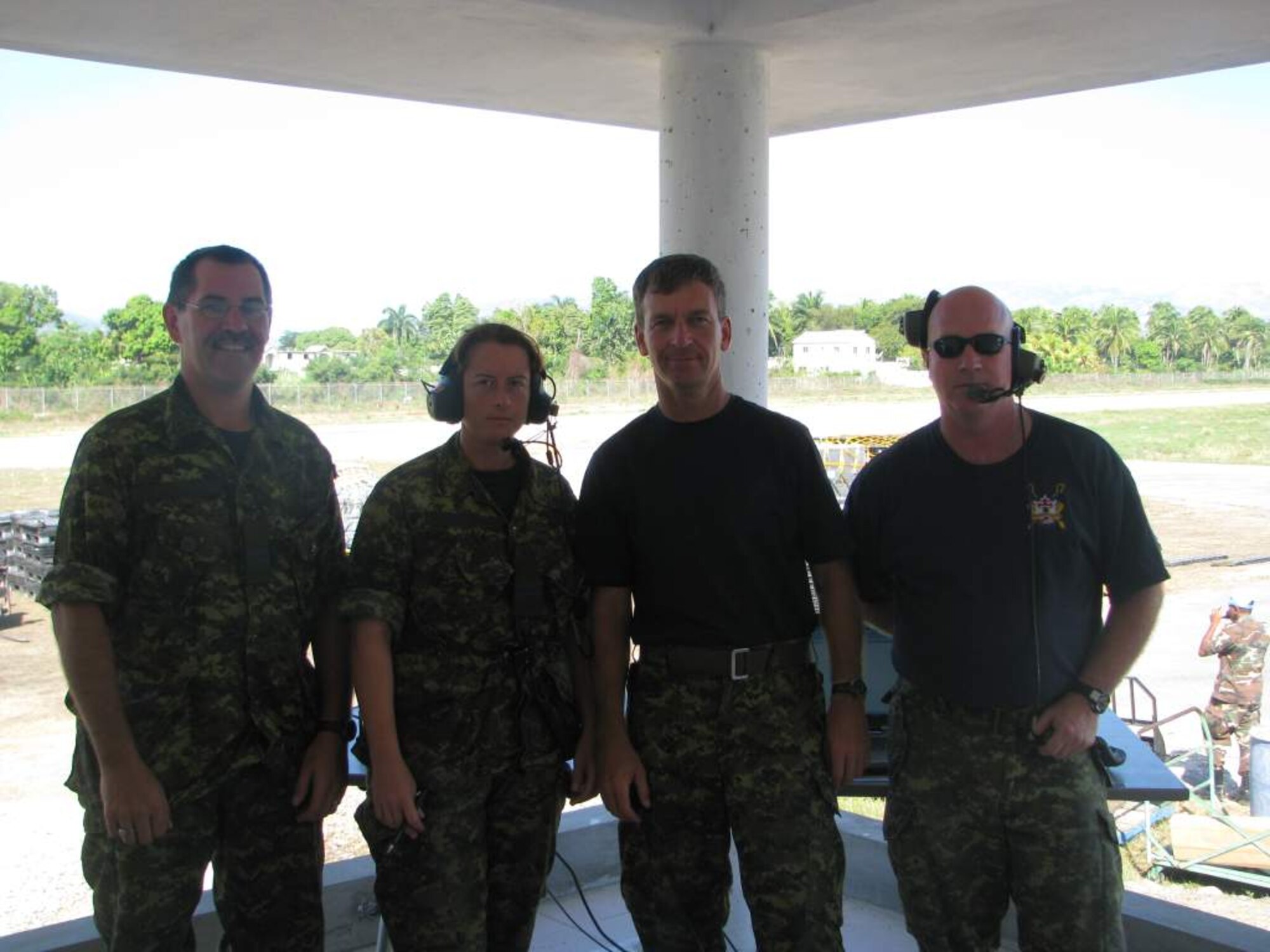 Capt. Rod Zeaton, 21st Operations Support Squadron, (left) joins his fellow Canadian Forces air traffic controllers, Capt. Sue Carignan, Capt. JP Commodore and Capt. Ken Hannon, in Jacmel, Haiti, where they directed up to 80 aircraft a day carrying medical supplies, personnel, food and water to the Haitian people after the devastating 7.0 earthquake Jan. 12. (Courtesy photo/ Capt. Rod Zeaton)