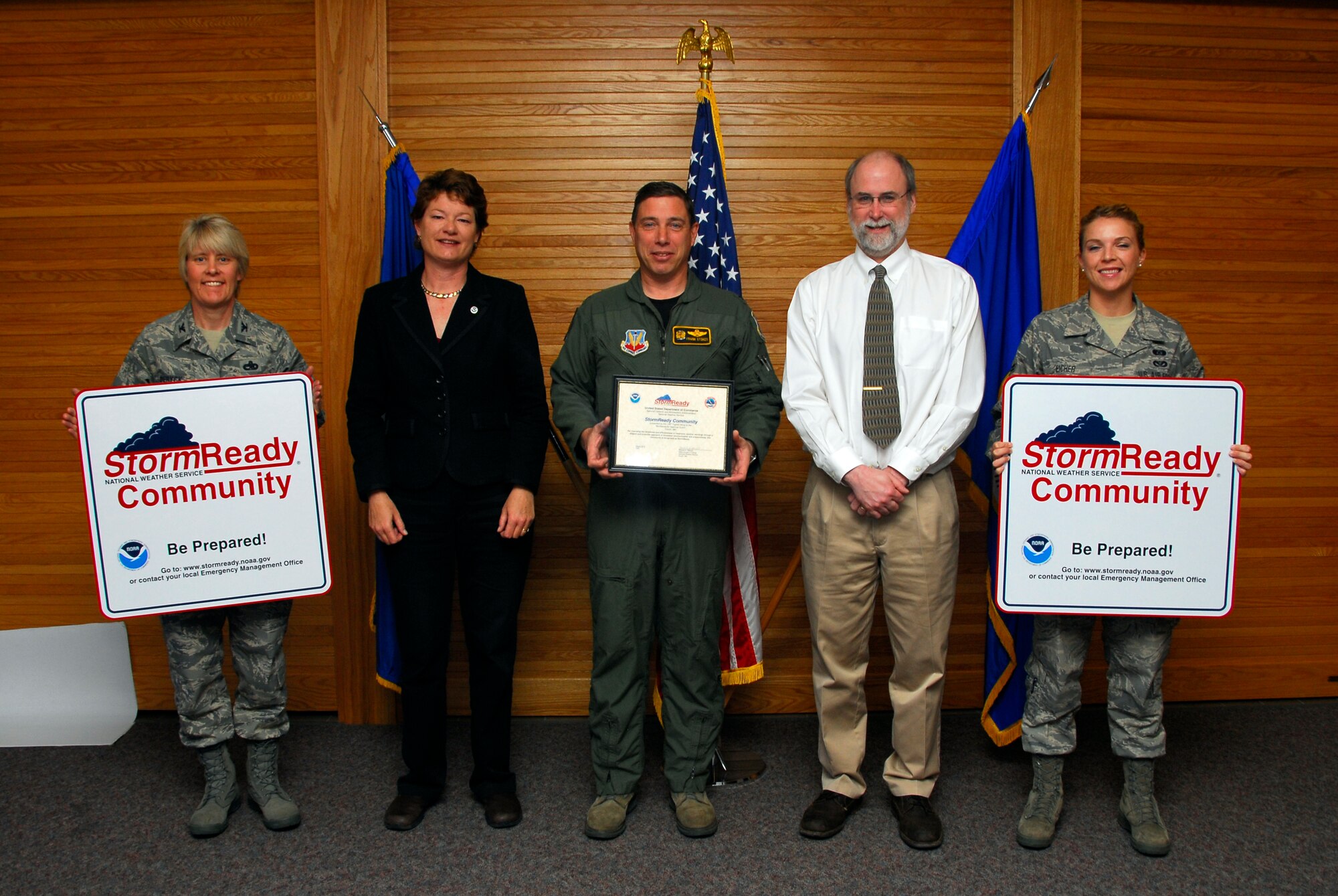 Mr. Michael R. Stewart, meteorologist in charge of the Duluth, Minn., National Weather Service (right center) presents the  148th Fighter Wing with certification as a StormReady Community at the Duluth, Minn., ANG Base May 3, 2010.  The 148th Fighter Wing has become the first National Guard unit to be certified by the National Weather Service as a StormReady Community. (U.S. Air Force photo by Master Sgt. Jason W. Rolfe/Released)