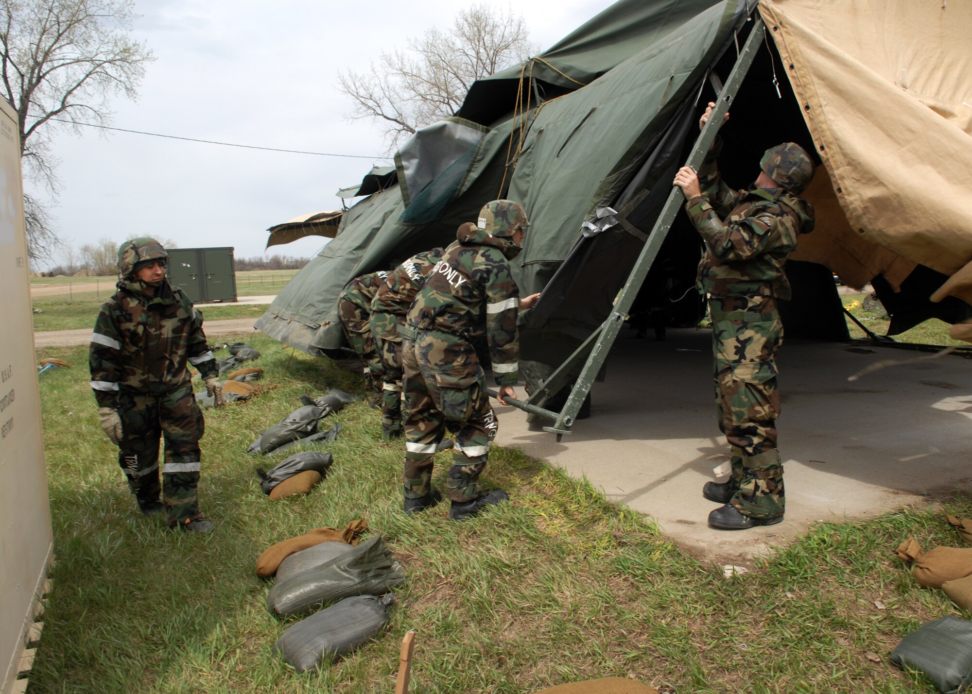 MINOT AIR FORCE BASE, N.D. – A group of Airmen tear down tents during an Ability To Survive and Operate, or ATSO, exercise here April 28. The focus of this exercise was to practice Ability to Survive and Operate, or ATSO skills and test the base personnel’s ability to respond to a crisis situation. (U.S. Air Force photo by Airman 1st class Aaron-Forrest Wainwright)