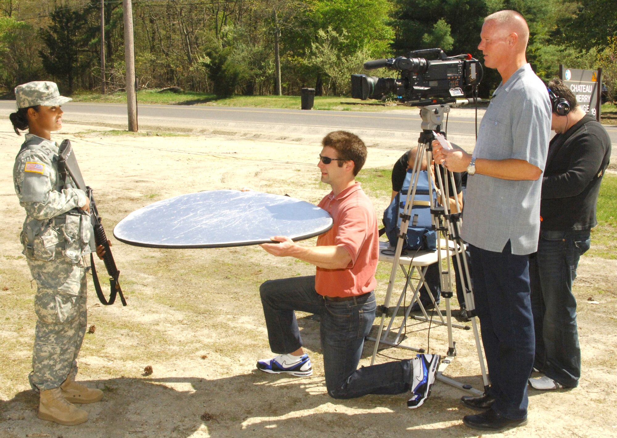 Pfc. Ammie Acosta, a member of the 302nd Information Operations Battalion, is interviewed by former major league pitcher Jeff Nelson April 23 here. The 302nd IO Battalion is an Army Reserve organization out of Fort Totten, N.Y. The Soldiers were here conducting M-16 weapons qualification as part of their drill-weekend training activities. This interview and others conducted that day will be displayed on MLB.com as part of the "Army Strong" marketing campaign to help promote Army recruitment. (U.S. Army photo/Ryan Morton)