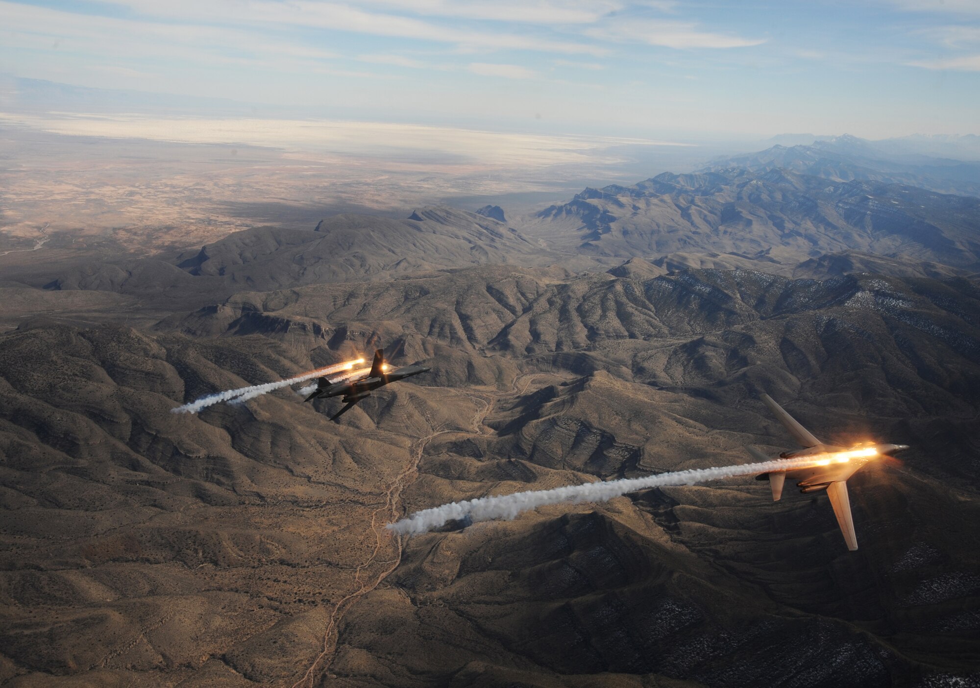 A two-ship formation of  B-1B Lancers assigned to the 28th Bomb Squadron, Dyess Air Force Base, Texas, release chaff and flares while maneuvering over New Mexico during a training mission Feb. 24, 2010.  Dyess celebrates the 25th anniversary of the first B-1B bomber arriving at the base. (U.S. Air Force photo/Master Sgt. Kevin J. Gruenwald)