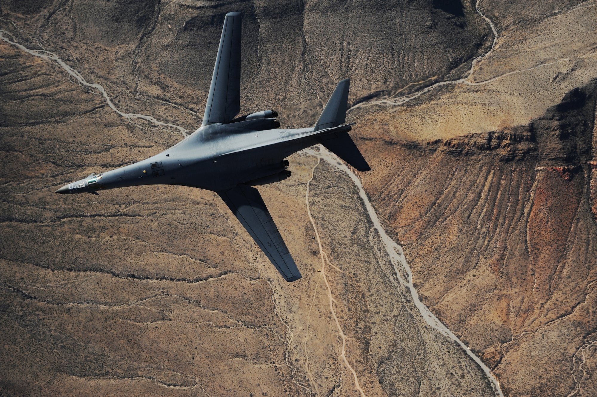 A B-1B Lancer assigned to the 28th Bomb Squadron, Dyess Air Force Base, Texas, maneuvers over New Mexico during a training mission Feb. 24, 2010.  (U.S. Air Force photo/Master Sgt. Kevin J. Gruenwald) 