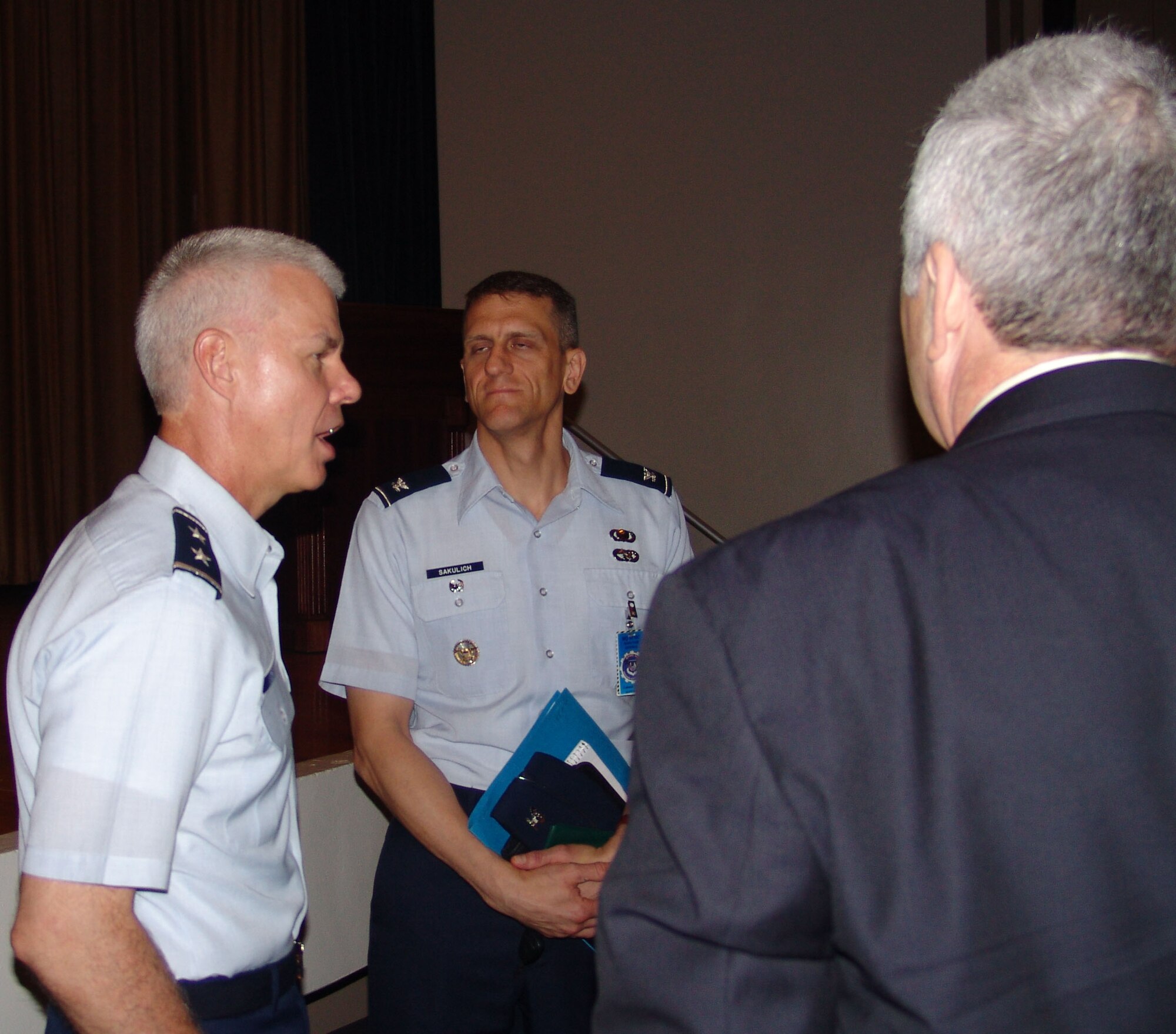 Maj. Gen. C. R. Davis, Program Executive Officer for Weapons and Air Armament Center commander, talks to Col. Ted Sakulich, the AFMC Inspector General, about the results of the Unit Compliance Inspection.  The UCI ran the week of April 26. (USAF photo)                      