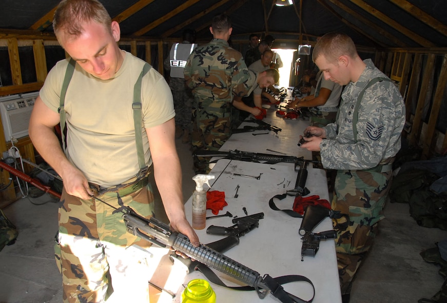 MAXWELL-GUNTER AIR FORCE BASE, Ala. – Airmen of the exercise evaluation team, “Blue Thunder,” clean rifles used during an emergency response exercise on Maxwell-Gunter Air Force Base, Ala., in February 2009. As the host unit for Maxwell-Gunter Air Force Base, the 42nd Air Base Wing's mission is critical to national security; it provides the foundation for success for Air University, the intellectual and leadership center of the Air Force; the 908th Airlift Wing; the 754th Electronic Systems Group; and more than 30 tenant units. (U.S. Air Force photo/Jamie Pitcher)