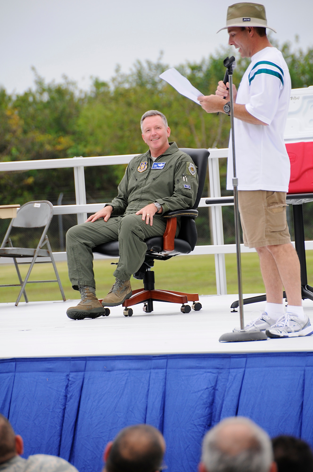 Master Sgt. Francisco Navarro emcees Brigadier General William Binger's farewell barbecue event during the May Unit Training Assembly at the Homestead Air Reserve Base. Guest were entertained with a variety of jokes, songs, stories, and heartfelt farewells. (US Air Force photo/Senior AIrman Lou Burton)