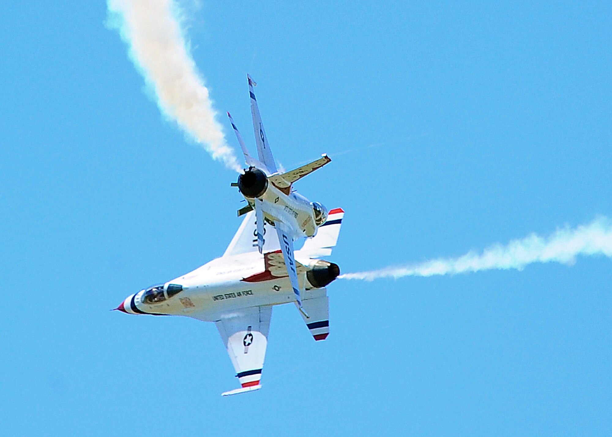 DYESS AIR FORCE BASE, Texas-- United States Air Force Thunderbird lead solo, Major Rick Goodman, and Opposing Solo, Captain Aaron Jelinek, perform the Crossover Break during the Dyess Big Country air fest, May 1. The Big Country air fest is held every other year on Dyess Air Force Base and features various aircraft performances as well as static displays. The air fest is held to bring the Abilene and Dyess communities together to demonstrate the capabilities of the Air Force. (U.S. Air Force photo/ Senior Airman Stephen Reyes)