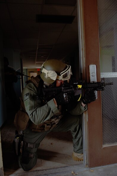 HOLLOMAN AIR FORCE BASE, N.M. -- Members of the Albuquerque Federal Bureau of Investigation stand guard during a hostage exercise April 28, 2010, at the base dormitories. The exercise involved 49th SFS Quick Reaction Force members, 49th SFS hostage negotiators; FBI hostage negotiators and FBI Special Weapons and Tactics teams from El Paso, Texas; Las Cruces and Albuquerque, N.M. Within the past year, Holloman security forces and the FBI have begun exercising joint Crisis Negotiation Team training.  This was the first exercise of its kind at Holloman involving both Crisis Negotiation and the SWAT teams. Future exercises are planned and will be larger in scope. (U.S. Air Force photo by Airman 1st Class Joshua Turner / Released)     