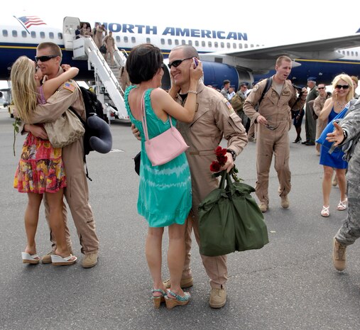 Wives, Fiances and Girlfriends ran to meet their Airmen as they set foot on American soil for the first time in four months at Joint Base Charleston, S.C., May 3, 2010. The Airmen from the 14th Airlift Squadron currently hold the record for the most pounds air dropped, which totaled over 8.1 million. The Airmen deployed to the Middle East in support of Operation Iraqi Freedom and Operation Enduring Freedom. (U.S. Air Force Photo/Airman 1st Class Lauren Main)
