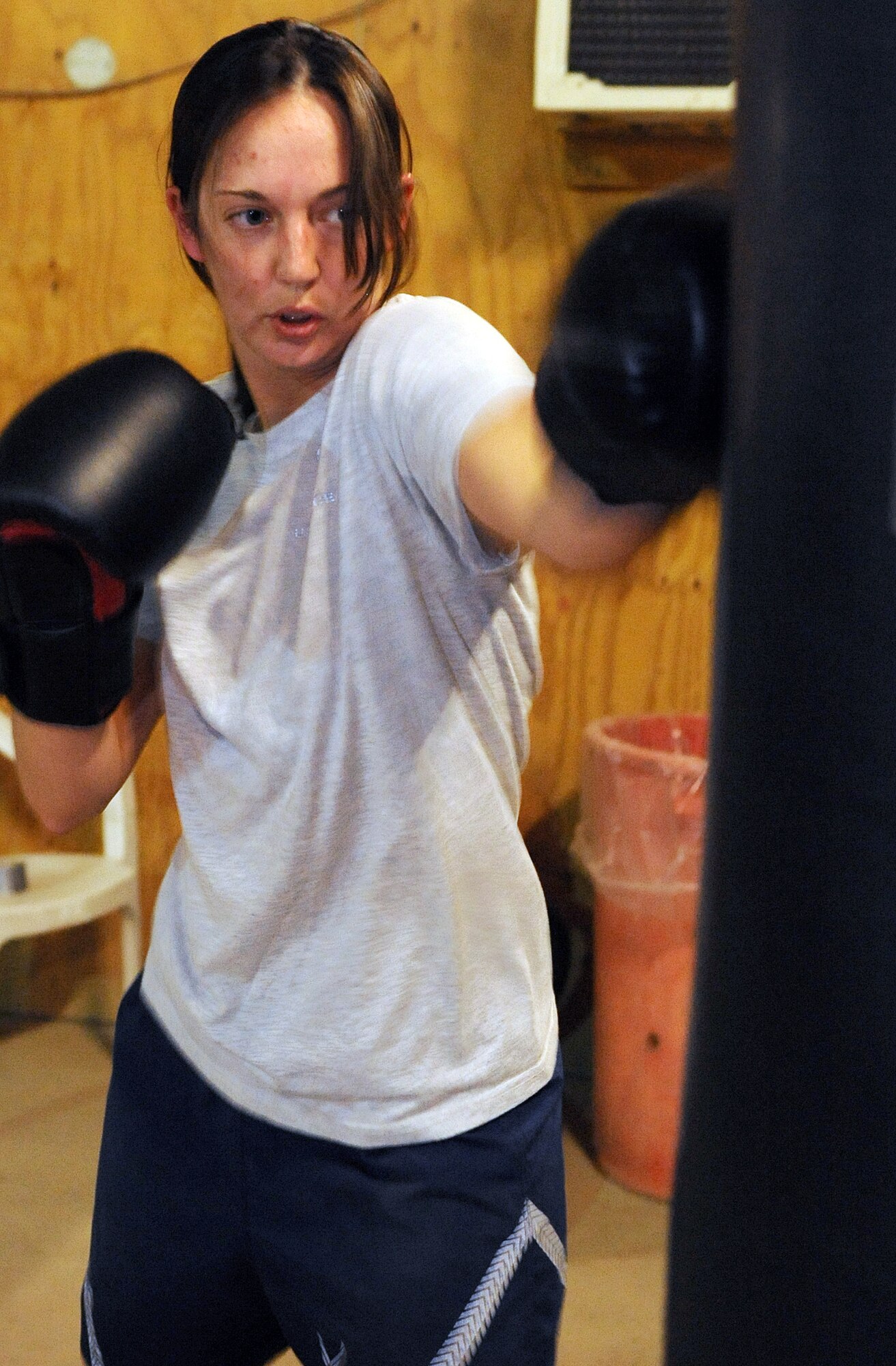 Staff Sgt. Vincent Carll, 506th Expeditionary Civil Engineer Squadron heavy equipment operator, trains Staff Sgt. Sandra Mihovich, 506th Security Forces Squadron military working dog trainer, at Kirkuk Regional Air Base, Iraq on April 28, 2010.  Sergeant Carll uses his experience as a mixed martial arts cage fighter to train his fellow servicemember to fight in the upcoming Smoker 3 boxing tournament May 8.  He is deployed from Homestead Air Reserve Base, Fla.  (U.S. Air Force photo/Staff Sgt. Tabitha Kuykendall/Released)