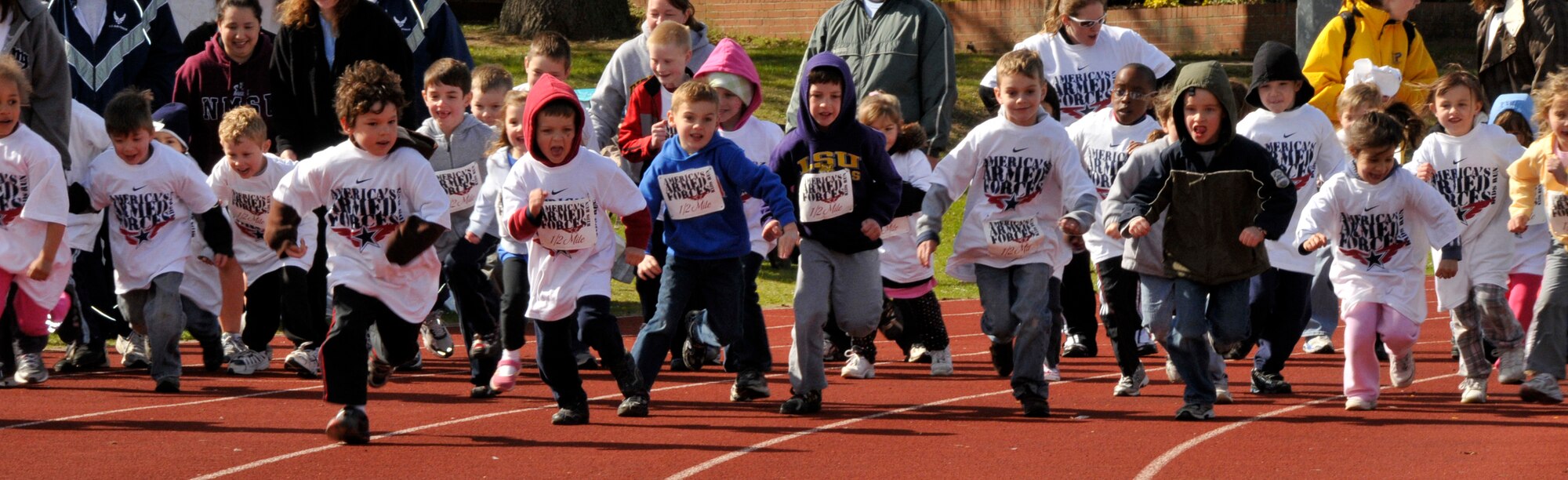 Children from the 5-6 age group take off for their half mile run at the 25th Annual Armed Forces Kids' Run May 3. Parents cheered on and even ran with their children. Every participant received a medal and a chance to stand on the winners’ podium. (U.S. Air Force photo/Airman 1st Class Eboni Knox)