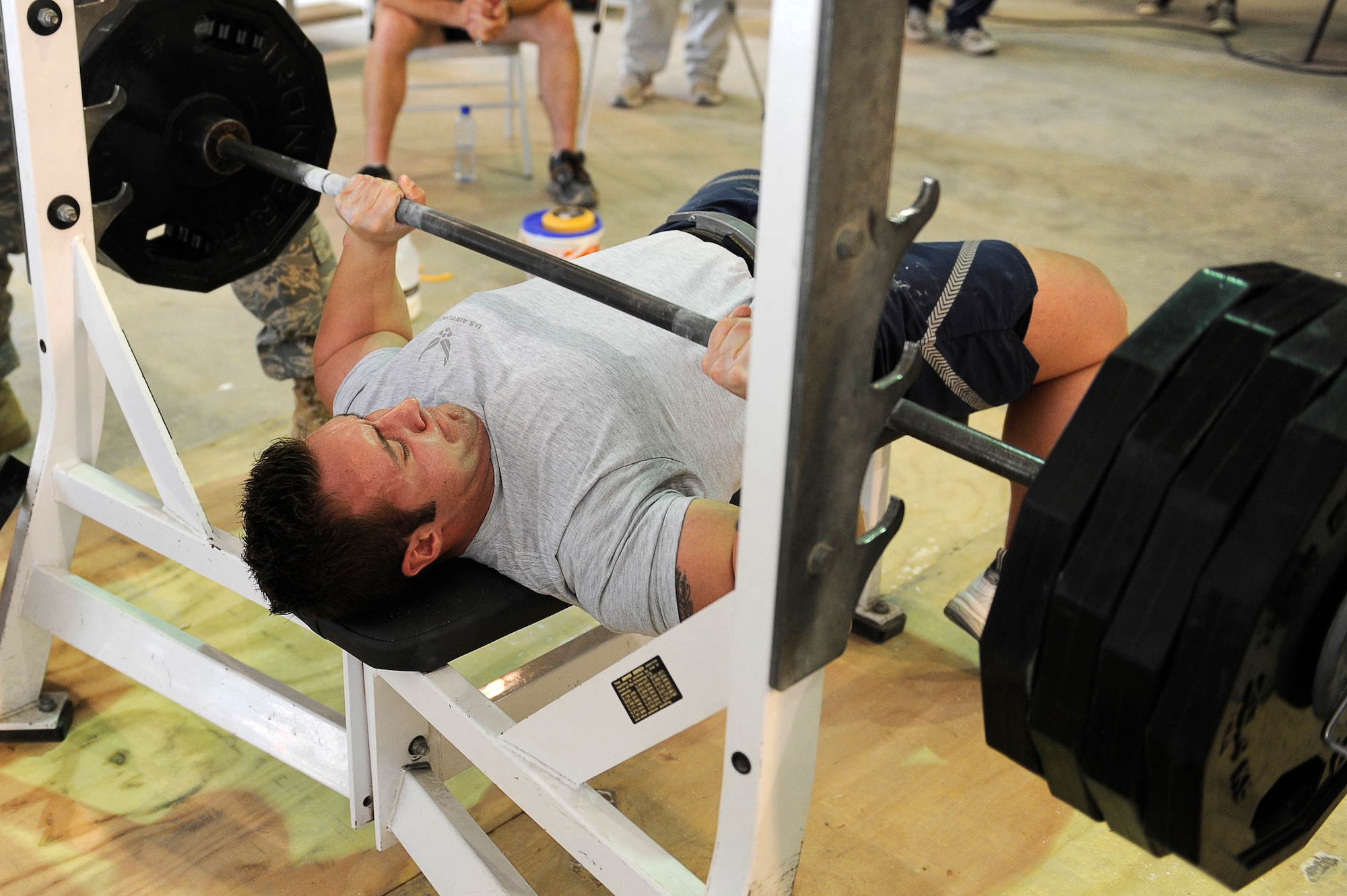 U.S. Air Force Senior Airman Ryan Baker, 455th Expeditionary Logistics Readiness Squadron, bench presses during the "Strongest in the Area of Operations" competition at Bagram Airfield, Afghanistan, May 1, 2010. Airman Baker is deployed from Hurlburt Field, Fla., and is from Indianapolis, Ind. (U.S. Air Force photo by/ Master Sgt. Jeromy K. Cross/released)