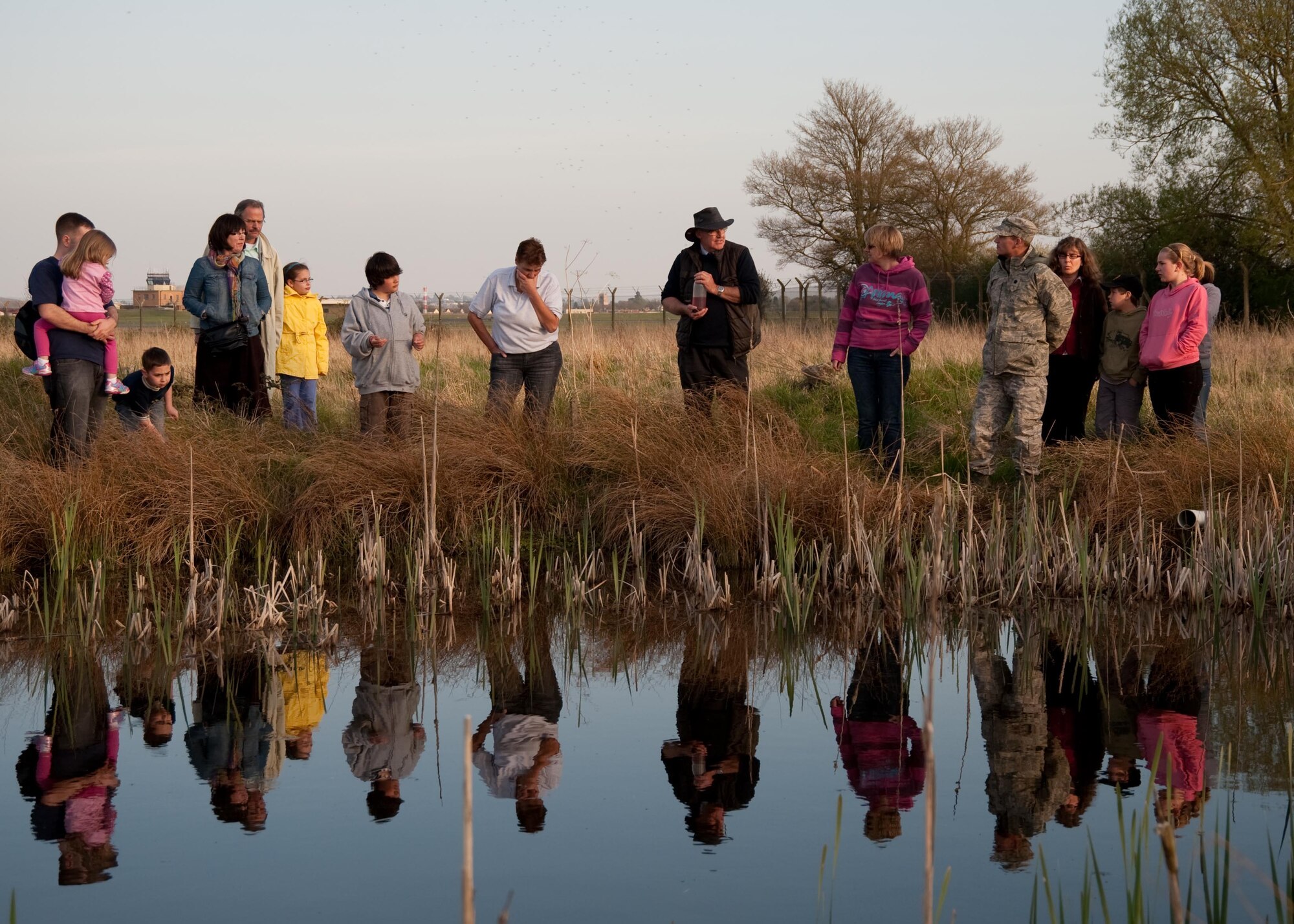 RAF FAIRFORD, United Kingdom - Members from the 420th Air Base Squadron went on a safari in search of the great crested newt April 22. Due to the steps taken at RAF Fairford, the population of the endagered newt has increased rapidly on base.
Respecting the presence of the great crested newt, the RIAT site services team install Herras fencing around the water storage site to prevent any unwanted public or show support personnel impacting on the water storage contents or the identified hibernacula.