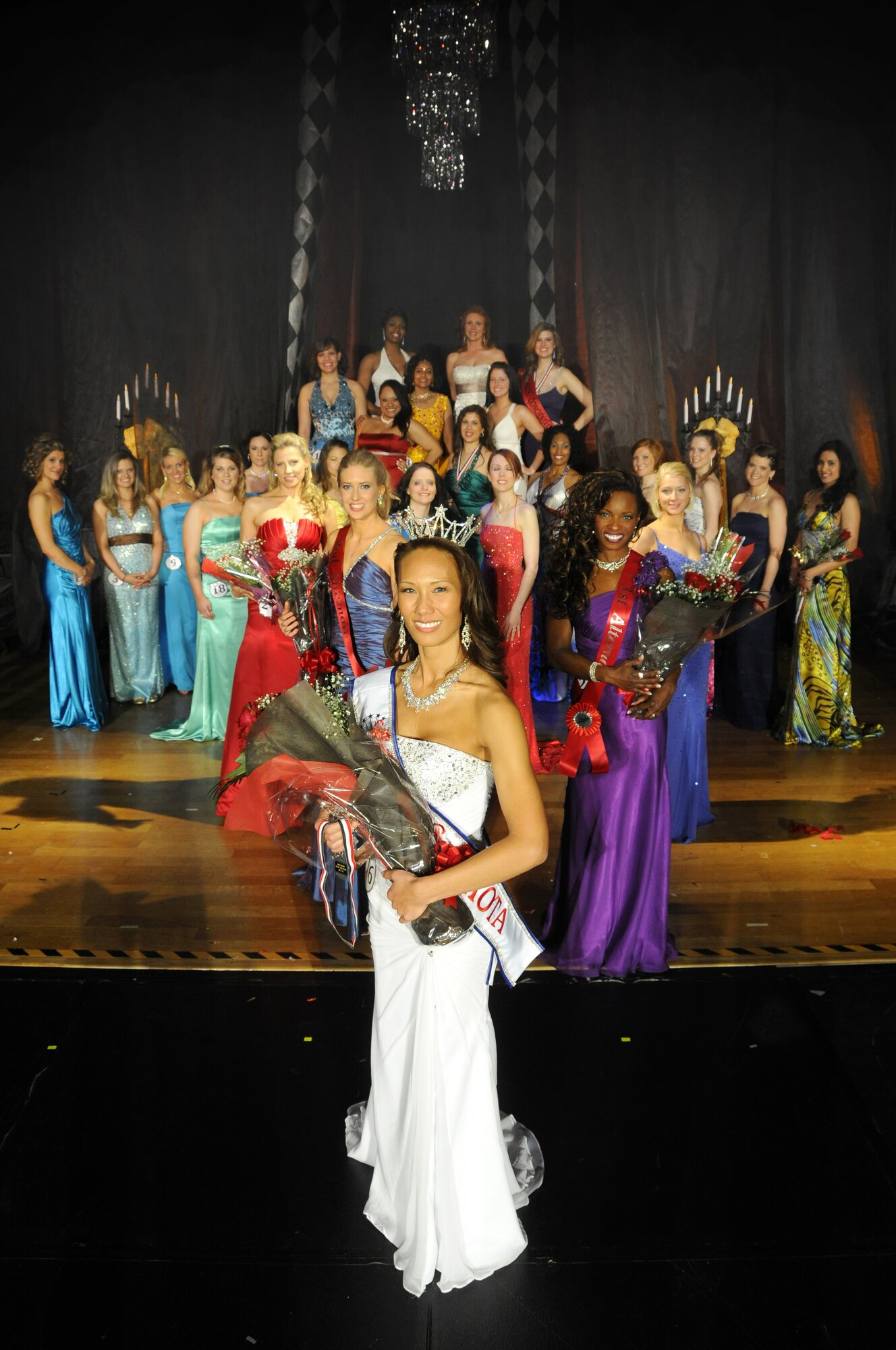 YOKOTA AIR BASE, Japan -- Contestants of the 2010 Mrs. Yokota Pageant pose for a group picture after the show. The Mrs. Yokota Organization is a non-profit organization created to provide scholarships to spouses of military members stationed at Yokota.  (U.S. Air Force photo/Mark Allen)