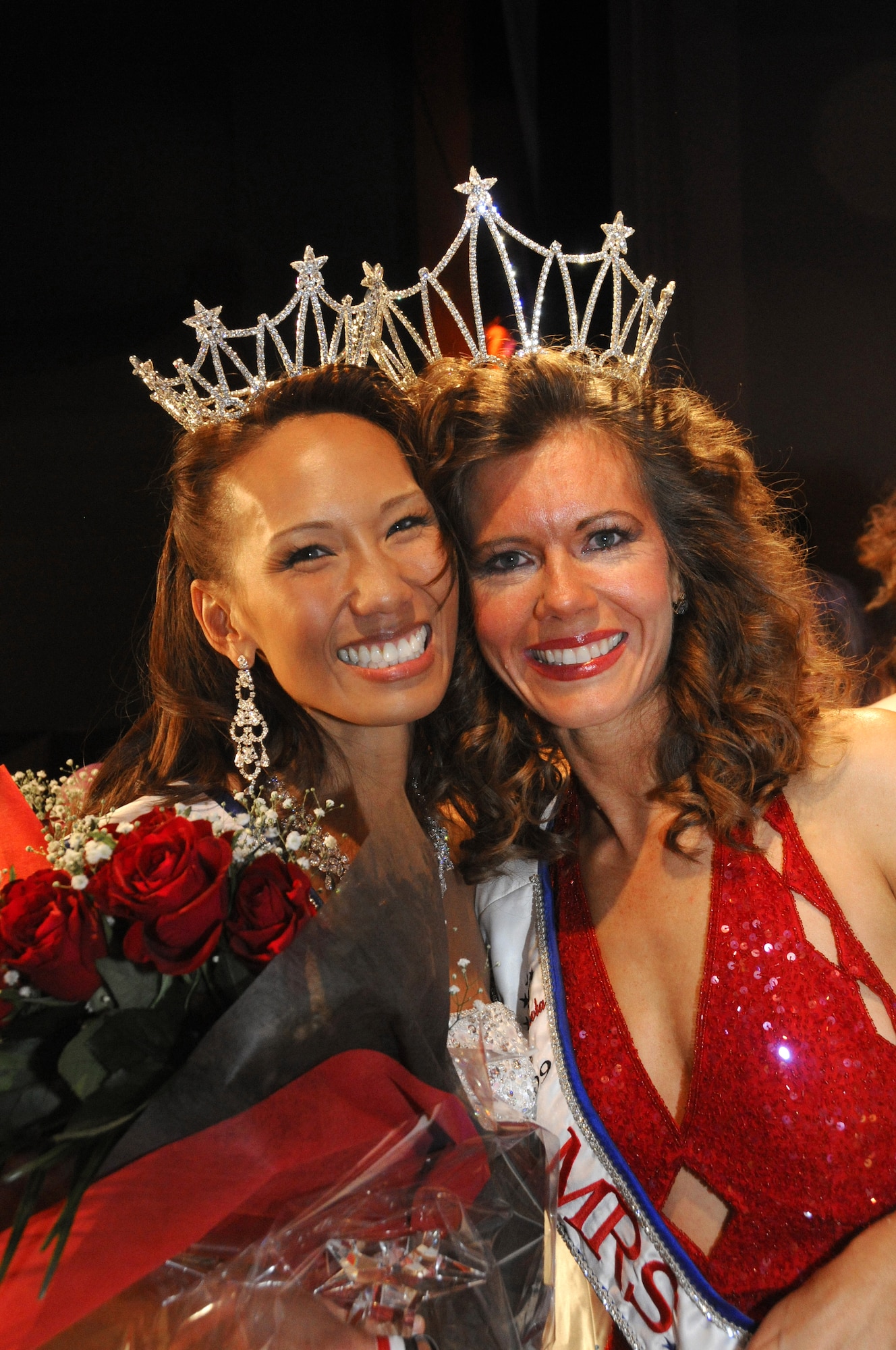 YOKATA AIR BASE, Japan -- Forence Bigsby, Mrs. Yokota 2010, poses with Heather Fife, Mrs. Yokota 2009. The Mrs. Yokota Organization is a non-profit organization created to provide scholarships to spouses of military members stationed at Yokota.  (U.S. Air Force photo/Mark Allen)